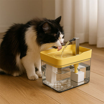 fontaine eau chat jaune l'hydratation idéale pour votre félin avec un chat noir et blanc buvant à une fontaine rectangulaire avec réservoir transparent et bec couleur acier inoxydable